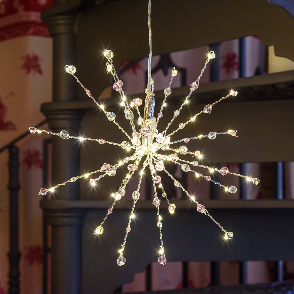 Stella luminosa con decorazioni rosa, 60 microled bianco caldo